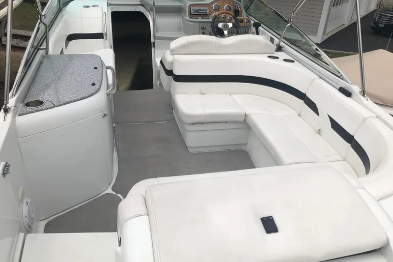 Slide: The Image of 2007 Formula 260 Sun Sport boat interior with white seating and modern dashboard. - 7