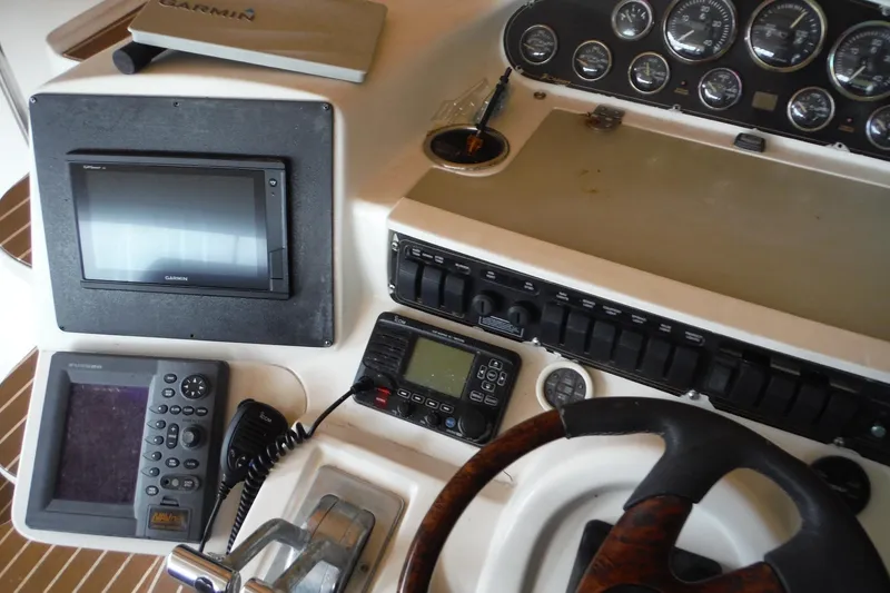 Slide: The Image of 1999 Cruisers 4270 Express helm with Garmin navigation and control instruments. - 10