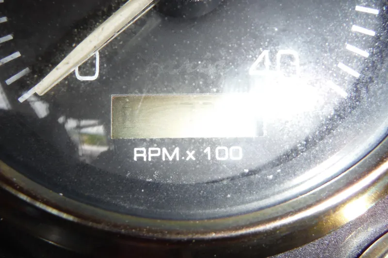Slide: The Image of Close-up of 1999 Cruisers 4270 Express RPM gauge, showing RPM x 100. - 35
