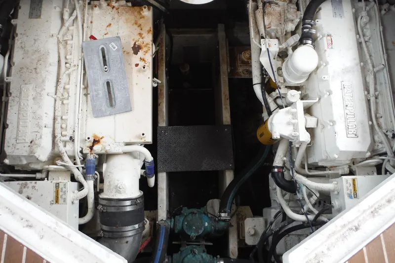 Slide: The Image of Engine room of a 1999 Cruisers 4270 Express, featuring dual Caterpillar engines. - 30