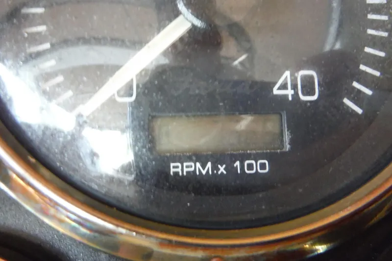 Slide: The Image of Close-up of a 1999 Cruisers 4270 Express RPM gauge, showing RPM x 100. - 36