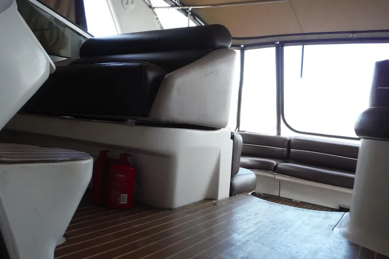 Slide: The Image of Interior of 1999 Cruisers 4270 Express yacht with seating and wooden flooring. - 40