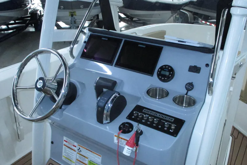 Slide: The Image of Boat dashboard with steering wheel, controls, and displays; Trophy model, 2022. - 4