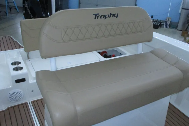 Slide: The Image of 2022 Trophy boat seating with beige upholstery and integrated storage. - 5