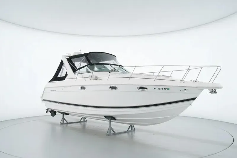 The Image of 2000 Formula 31 Performance Cruiser boat displayed in a white showroom. - 0