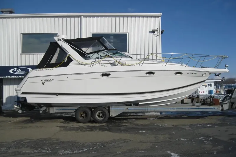 Slide: The Image of 2000 Formula 31 Performance Cruiser on trailer outside a building. - 1