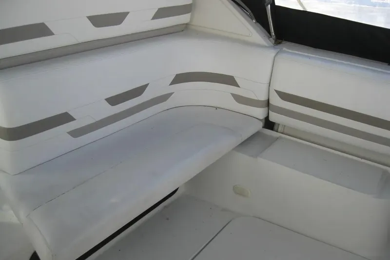 Slide: The Image of Interior seating of a 2000 Formula 31 Performance Cruiser, featuring white and gray upholstery. - 11