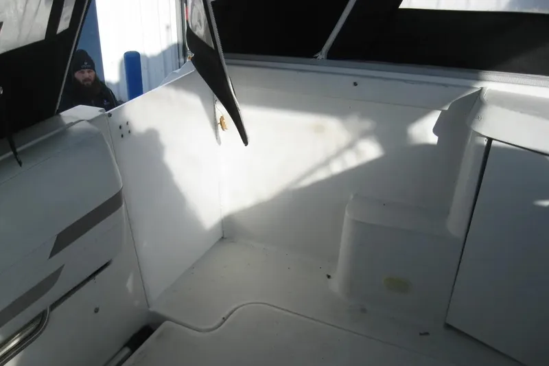 Slide: The Image of 2000 Formula 31 Performance Cruiser interior with open compartments and seating area. - 14