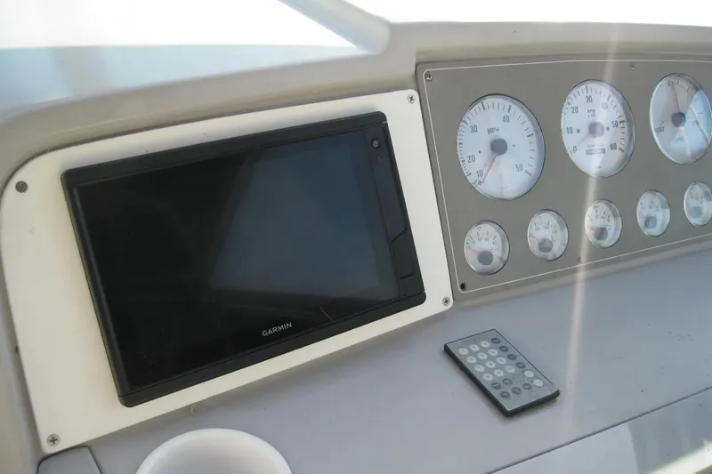 Slide: The Image of Dashboard of 2000 Formula 31 Performance Cruiser with Garmin display and gauges. - 19