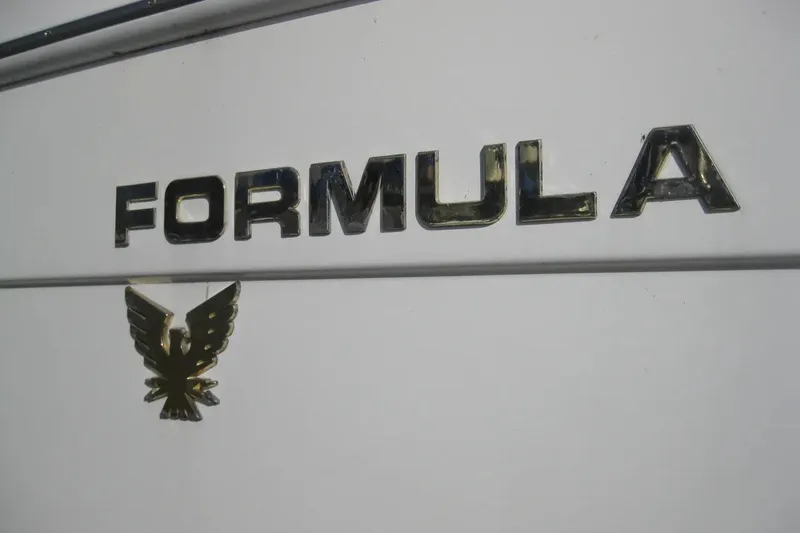 Slide: The Image of 2000 Formula 31 Performance Cruiser logo with eagle emblem on white background. - 4