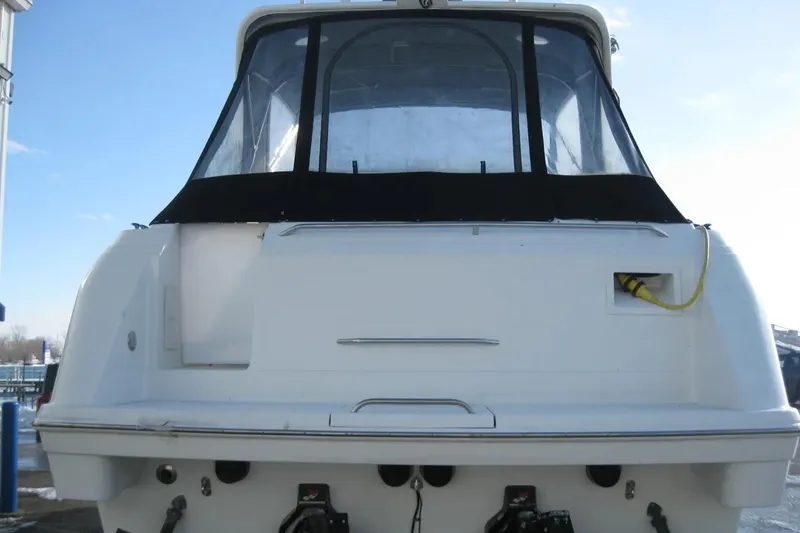 Slide: The Image of Rear view of a 2000 Formula 31 Performance Cruiser boat at dock. - 6