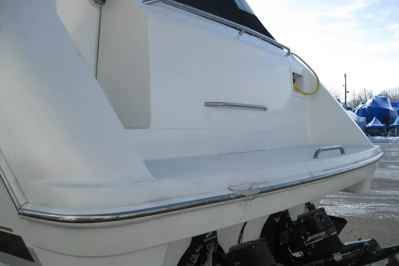 Slide: The Image of Rear view of a 2000 Formula 31 Performance Cruiser boat, showcasing the swim platform. - 7