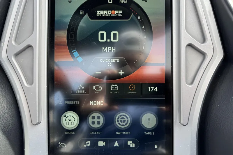 Slide: The Image of Dashboard display of a 2018 Tigé RZX3 boat showing speed and control settings. - 13
