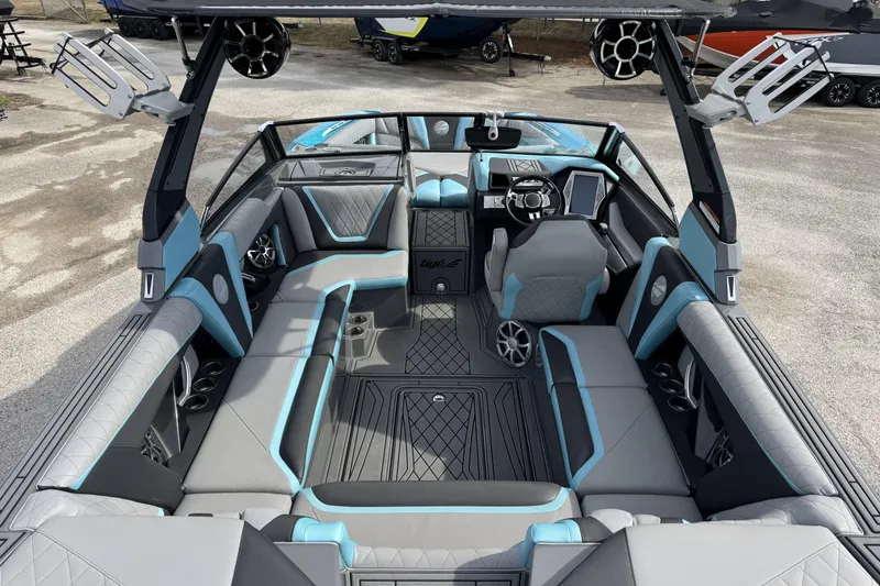 Slide: The Image of 2018 Tigé RZX3 boat interior with modern seating and sleek design. - 8