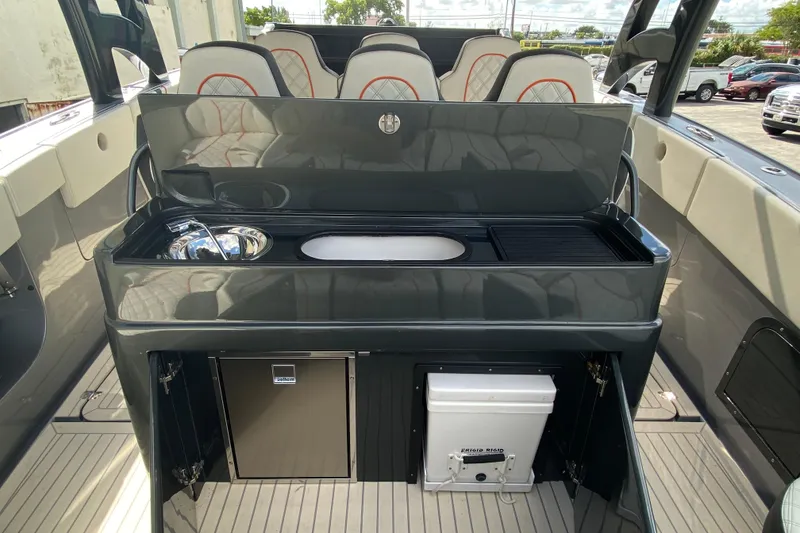 Slide: The Image of Luxury interior of Midnight Express 43 Open boat with sleek kitchenette and seating. - 6