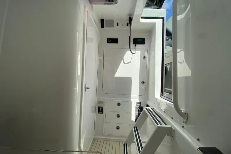 Slide: The Image of Interior of Midnight Express 43 Open boat, featuring sleek white design and modern equipment. - 8