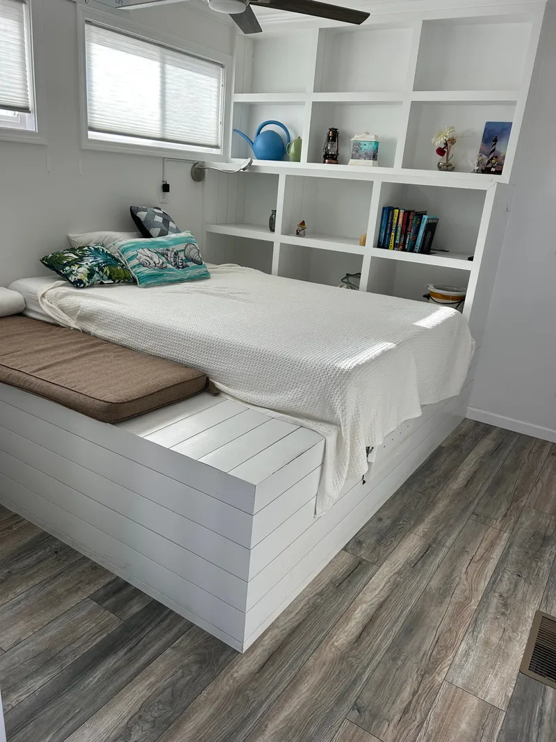 Slide: The Image of Interior of 2019 Harbor Cottage Tiny Boat with kitchen and living area. - 11