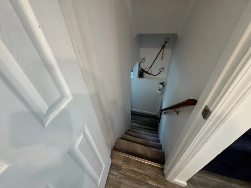 Slide: The Image of Staircase in a 2019 Harbor Cottage Tiny Boat with anchor decor. - 28