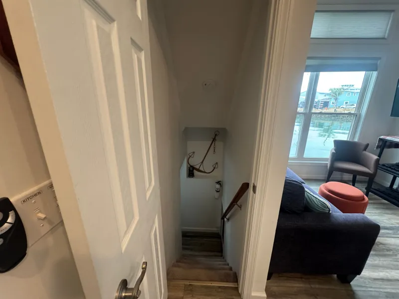 Slide: The Image of Interior view of a 2019 Harbor Cottage tiny boat with staircase. - 29