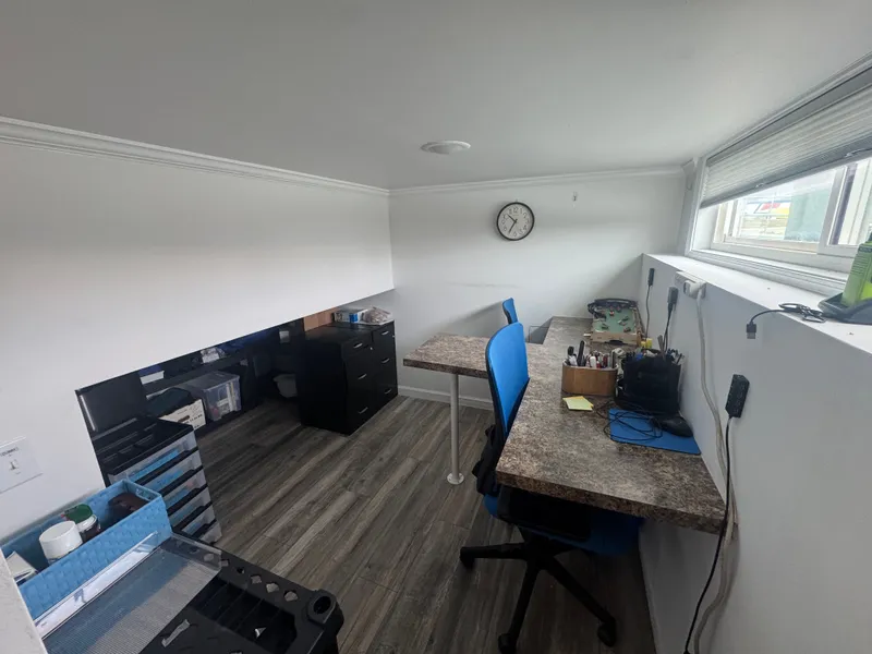 Slide: The Image of Office space in 2019 Harbor Cottage Tiny Boat with desk and chair. - 34