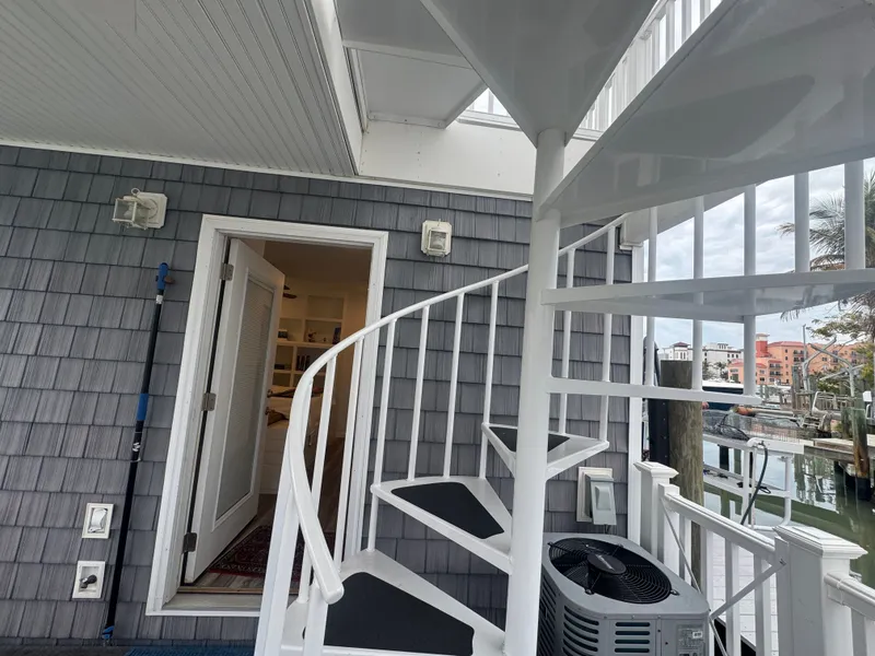 Slide: The Image of White spiral staircase on a Harbor Cottage tiny boat. - 45