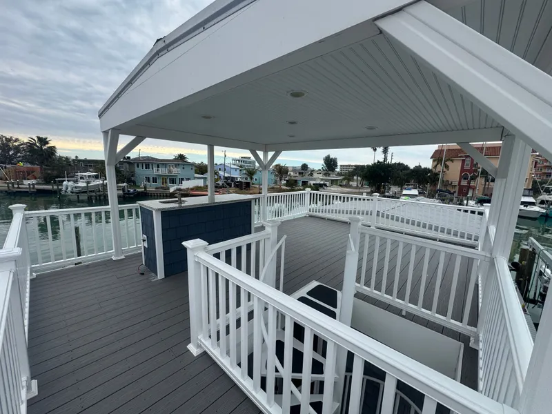 Slide: The Image of Deck of a 2019 Harbor Cottage tiny boat overlooking the harbor. - 46
