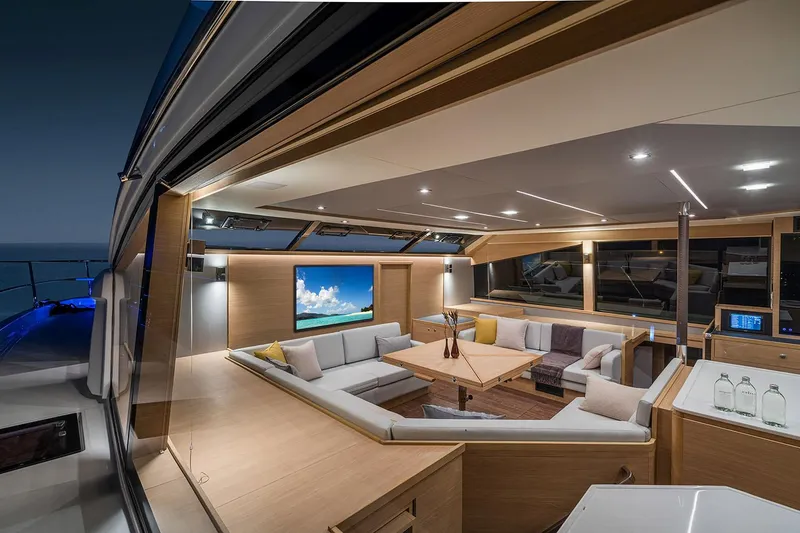 Slide: The Image of Manufacturer Provided Image: Luxurious interior of 2026 Aquila 54 Yacht with modern seating and ambient lighting. - 11