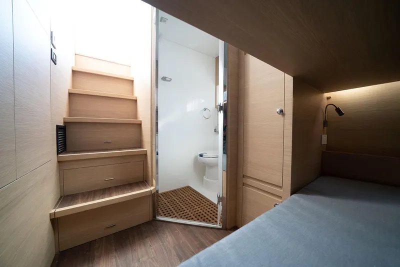 Slide: The Image of Manufacturer Provided Image: Interior of 2026 Aquila 54 Yacht featuring stairs, bathroom, and cozy cabin space. - 15