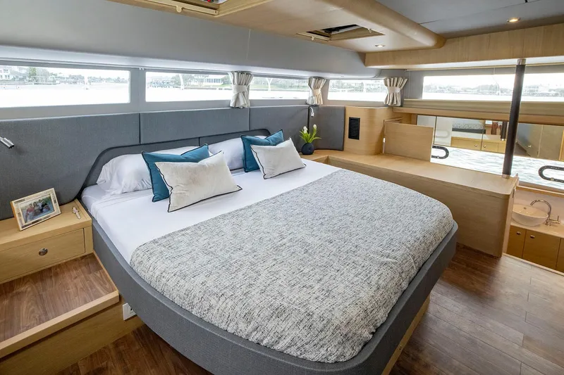 Slide: The Image of Manufacturer Provided Image: Luxurious bedroom interior of 2026 Aquila 54 Yacht with modern design and large windows. - 18