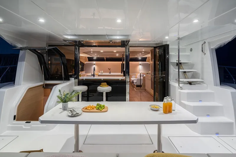 Slide: The Image of Manufacturer Provided Image: Luxurious 2026 Aquila 54 Yacht interior with elegant dining area and modern kitchen. - 4