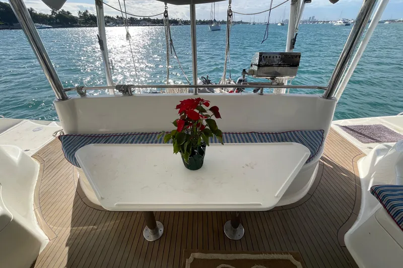 Slide: The Image of Compact kitchen in 2010 Knysna 480 yacht with stove, red microwave, and kettle. - 14