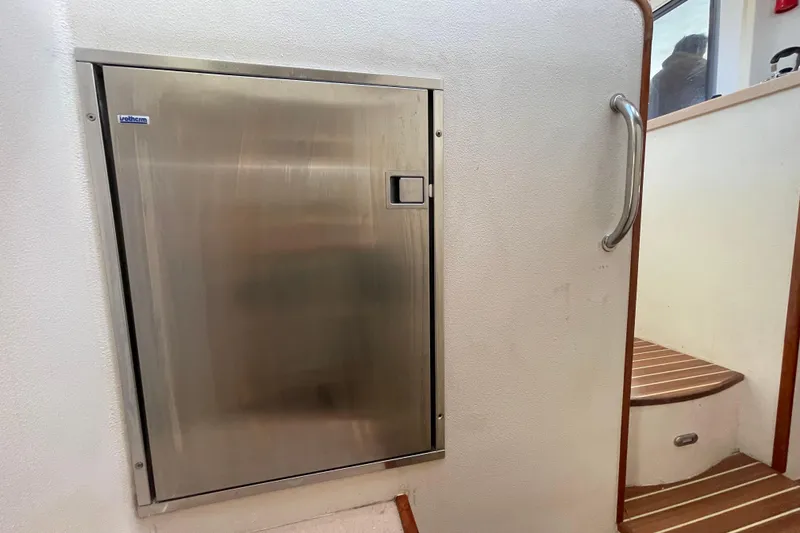 Slide: The Image of Interior of 2010 Knysna 480 yacht with kitchen, dog, and ocean view. - 25