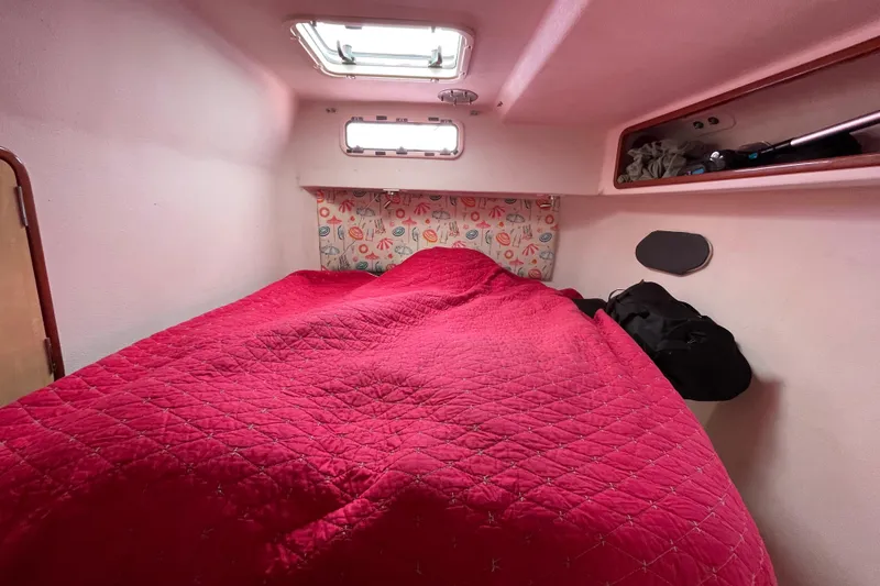 Slide: The Image of Interior of 2010 Knysna 480 yacht, featuring cozy cabin and bathroom. - 33