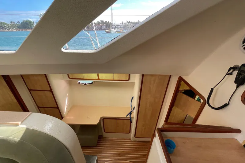 Slide: The Image of Compact bathroom in 2010 Knysna 480 yacht with shower and storage shelves. - 36