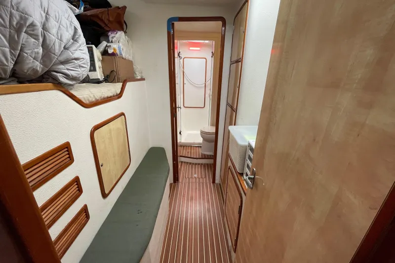 Slide: The Image of Cozy cabin interior of 2010 Knysna 480 yacht with bed and storage. - 39