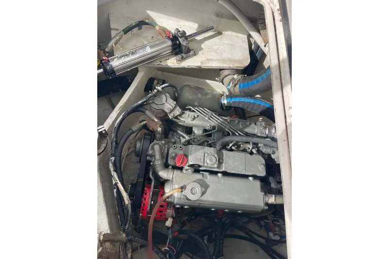 Slide: The Image of Solar panel setup on a 2010 Knysna 480 catamaran, overlooking a scenic harbor. - 47