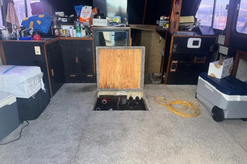 Slide: The Image of Interior of a 1977 Pacifica 44 Convertible boat with open floor hatch. - 10