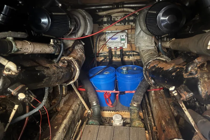 Slide: The Image of Engine room of a 1977 Pacifica 44 Convertible with blue barrels and mechanical components. - 11