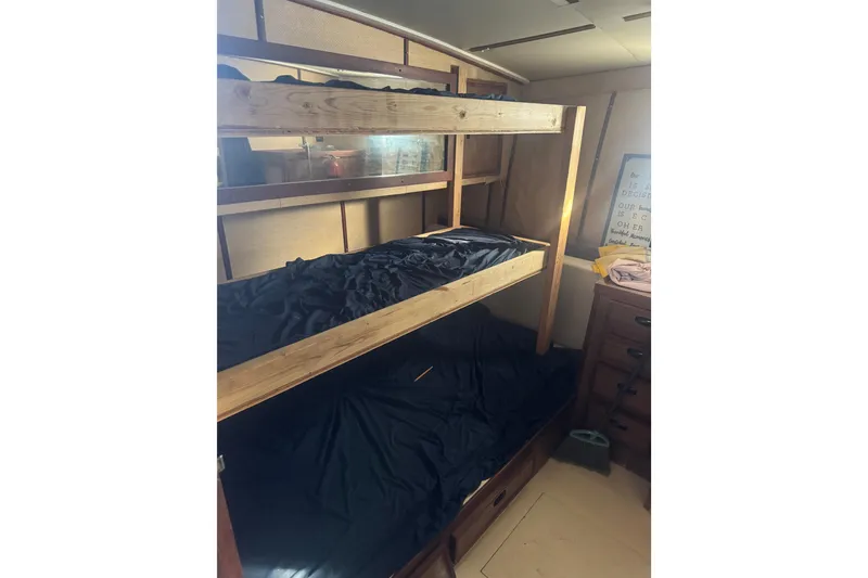 Slide: The Image of Interior of 1977 Pacifica 44 Convertible with wooden bunk beds and storage. - 12