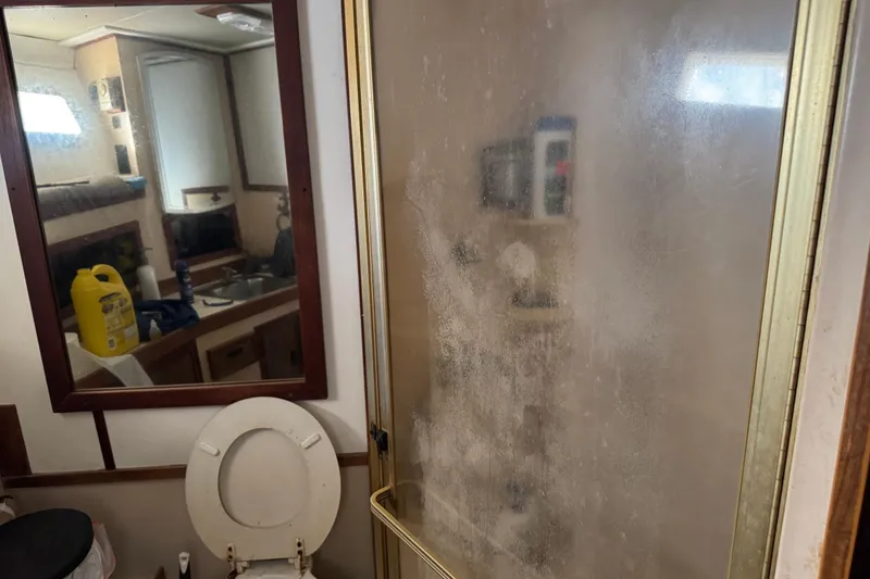 Slide: The Image of Bathroom interior of 1977 Pacifica 44 Convertible with shower and mirror reflection. - 16