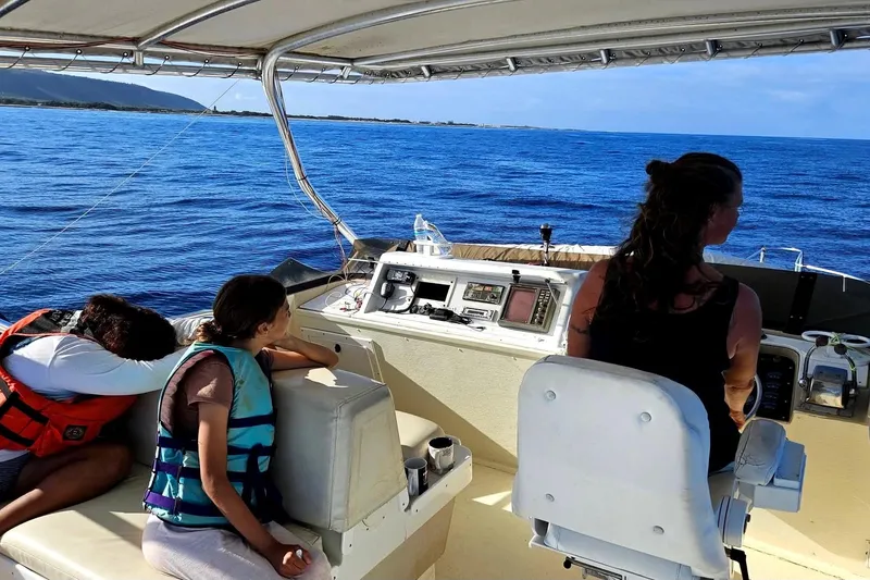 Slide: The Image of People enjoying a boat ride on a 1977 Pacifica 44 Convertible yacht. - 4