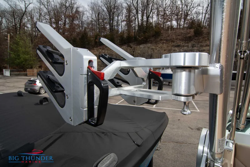 Slide: The Image of 2024 MasterCraft NXT24 boat with advanced wakeboard rack in a parking lot. - 44