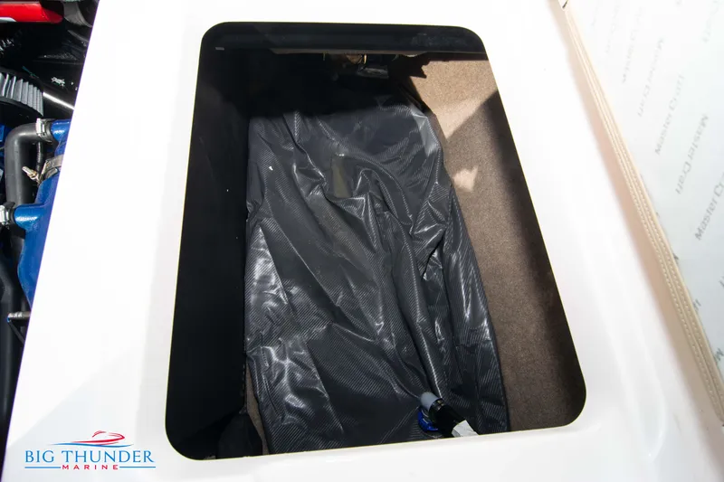 Slide: The Image of Storage compartment in 2024 MasterCraft NXT24 boat, featuring interior details. - 52