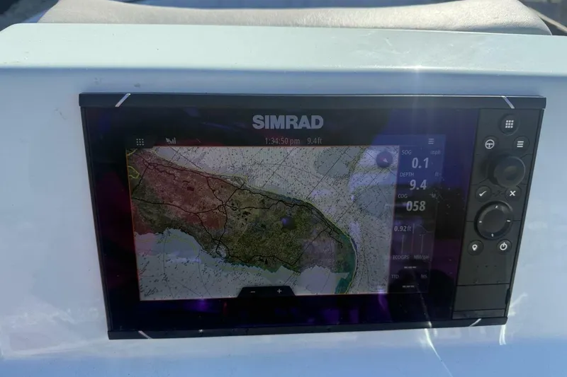Slide: The Image of Simrad navigation display on 2023 Hell's Bay Marquesa boat, showing detailed map and data. - 10