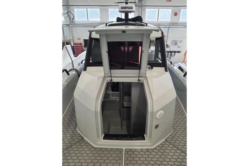 Slide: The Image of Close-up of 2021 XO Boats DFNDR9 throttle controls with illuminated indicators. - 13