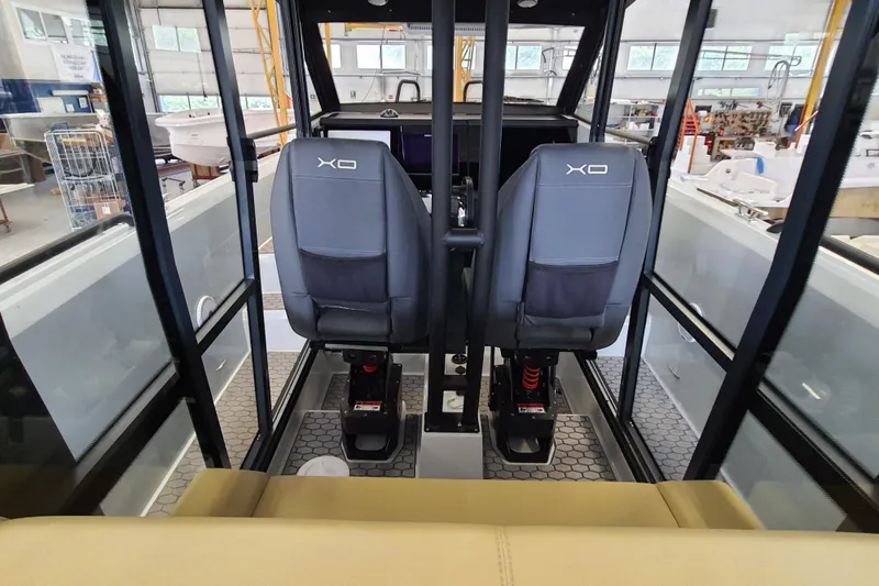 Slide: The Image of Beige seat on 2021 XO Boats DFNDR9 with Trailer, showcasing interior design. - 15