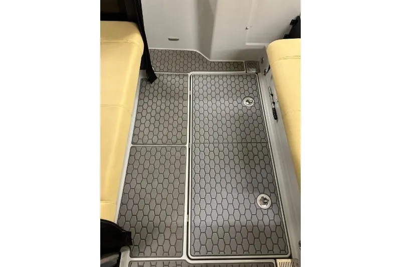 Slide: The Image of 2021 XO Boats DFNDR9 trailer in a garage, showcasing storage and equipment. - 26