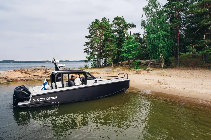 Slide: The Image of 2021 XO Boats DFNDR 9 interior with yellow seating and dual Mercury engines. - 39