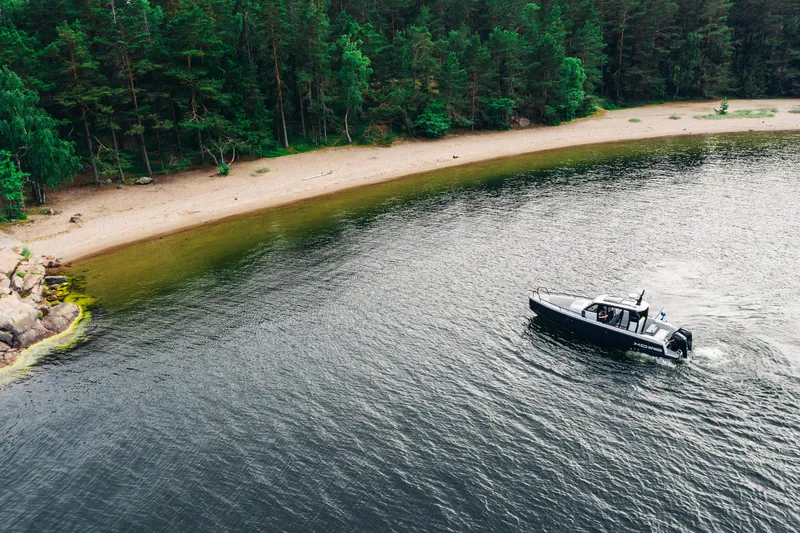 Slide: The Image of 2021 XO Boats DFNDR 9 interior view, showcasing modern seating and cabin design. - 40