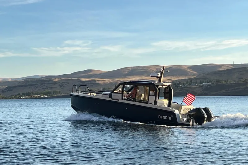 Slide: The Image of Control panel of 2021 XO Boats DFNDR 9 with Simrad navigation system. - 43